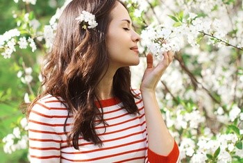 girl smelling flowers